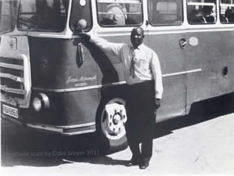 Mr Mtshumayeli in front of one of his buses